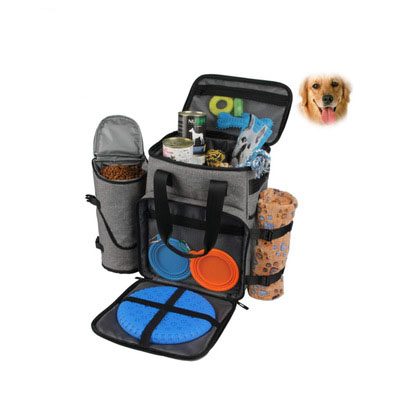 Dog travel bag with food, water, and toys on a white background