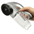Handheld vacuum cleaner with clear dustbin and black brush head held by a hand on a white background