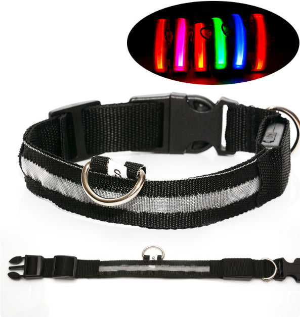 Black dog collar with reflective strip and LED light feature on a white background