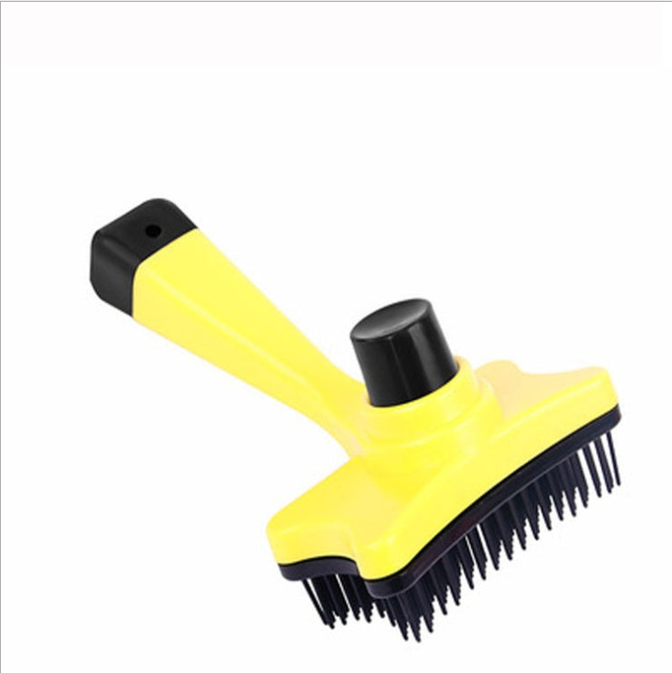 Yellow grooming brush with black bristles and handle on a white background